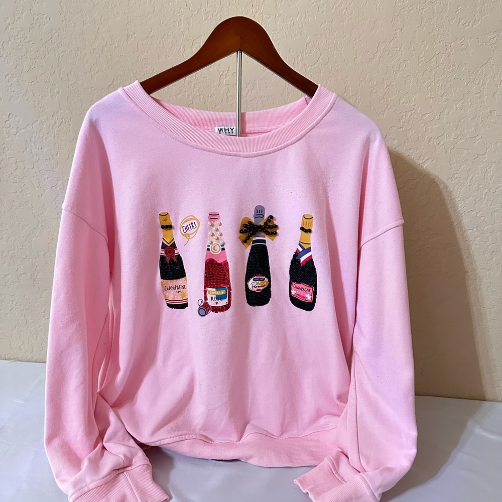 Playful Pink Sweater with Bottle Design